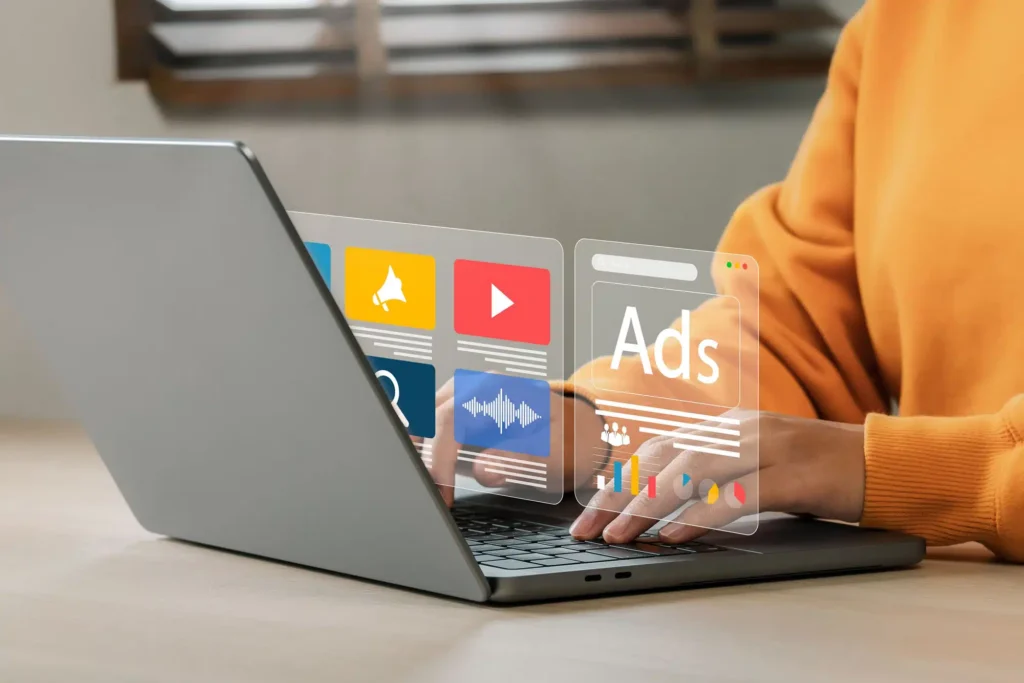 person managing google ad grant account on laptop